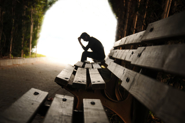 Depressed Man Sitting on a Bench.